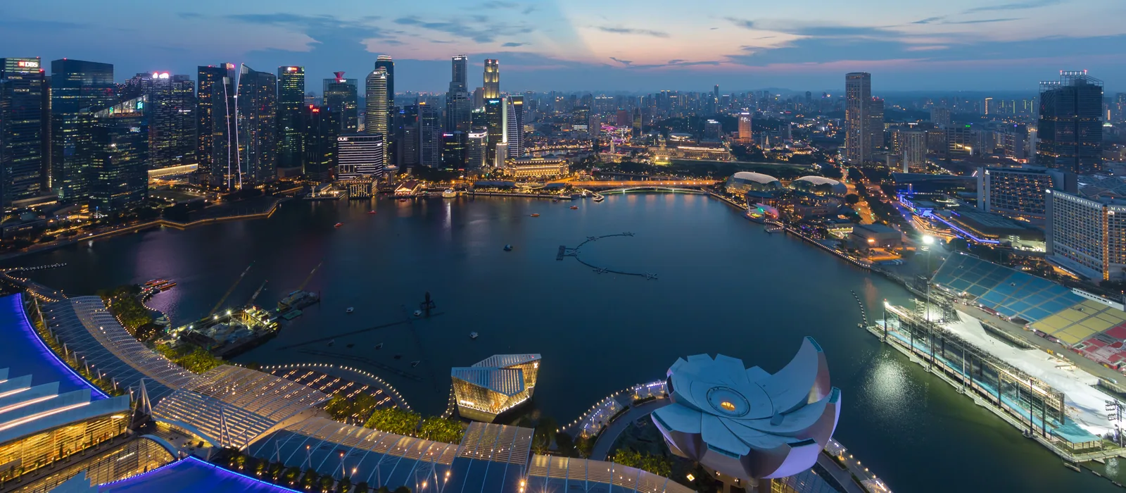 Marina Bay and Singapore’s Central Business District at dusk, viewed from Marina Bay Sands